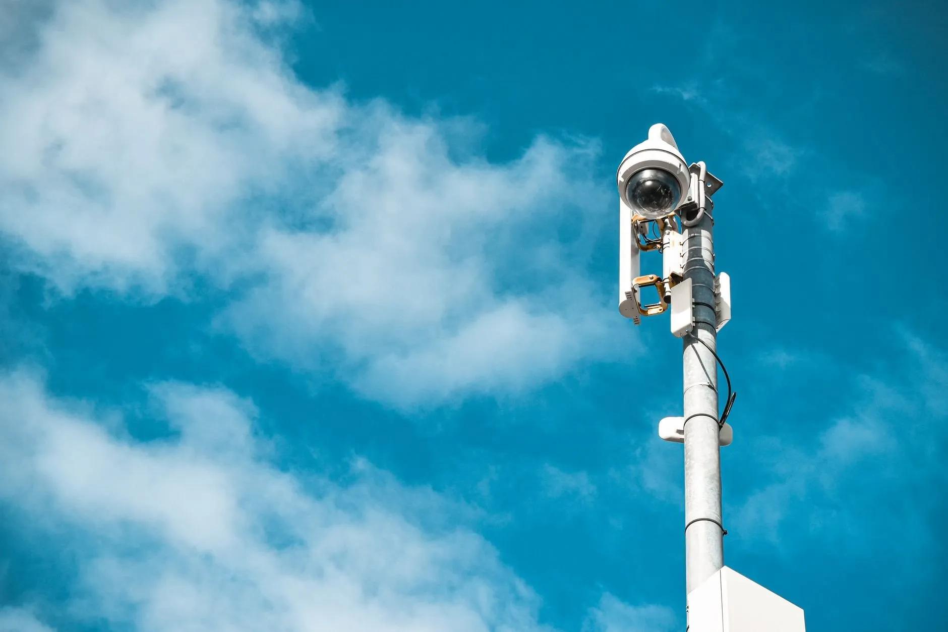A surveillance camera on a pole