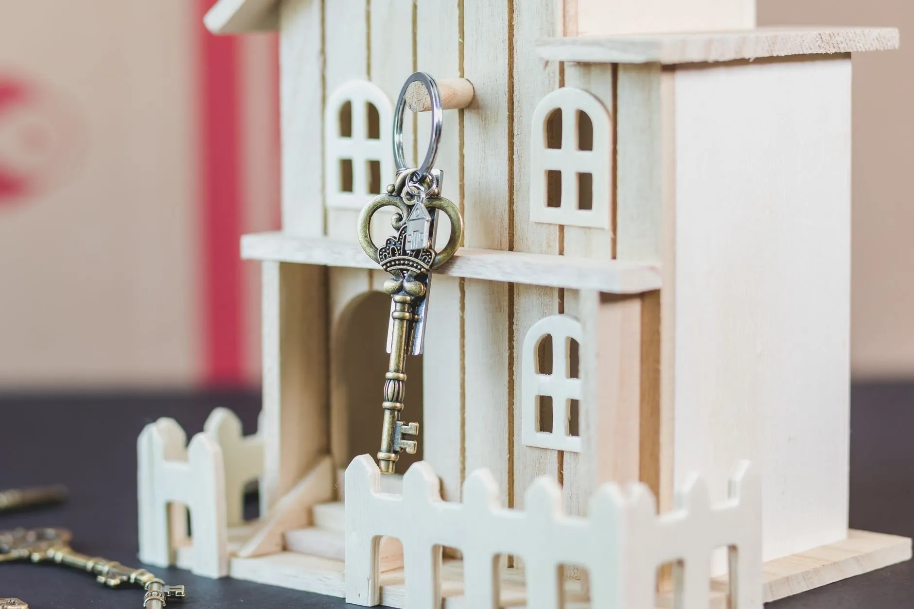 A small wooden house with a key